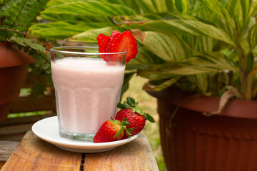 Strawberry smoothie with milk served in a glass beverage breakfast