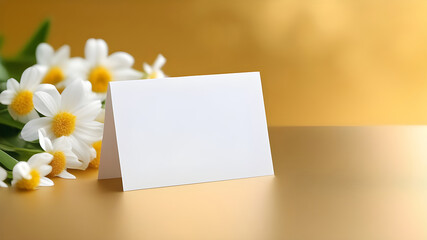 White sheet, letterhead, invitations on a gold background with flowers.