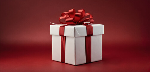 Obraz premium Christmas or valentines day gift box, red white present on red background