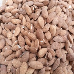 Fototapeta premium Close up of almonds. Almond texture macro almond brown almond.