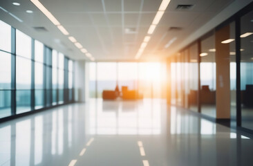 Blurred empty modern office. Defocused abstract light bokeh business open space interior background for design. Corporate strategy, finance, operations, marketing. Blur focus of tables with computers