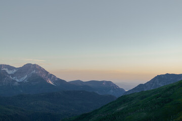 Fototapeta premium Sunset over the Hills and Mountains