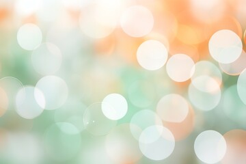 Blurred bokeh background in pastel colors of mint, peach, and white