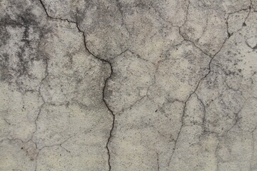 Grungy old white wall with cracks. Real cracks on wall