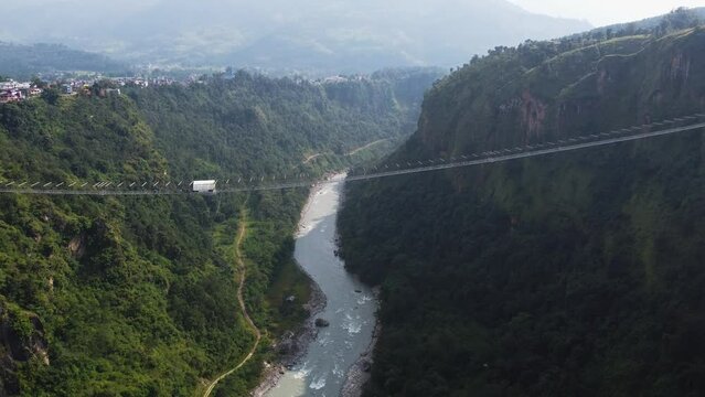 Spectacular aerial descending under Kushma suspension bridge