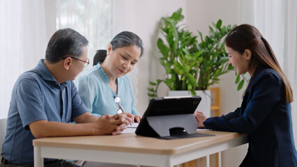 Financial advisor,realtor agent,insurance,lawyer,Manage your retirement fund concept.Financial advisor showing presentation on computer,deal shake hand to happiness Elderly asian couple retirement