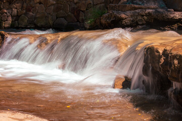 Waterfall on a rocky river in the mountains