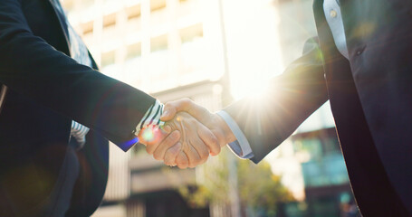 Business people, handshake and city for partnership, agreement or greeting in outdoor deal or...