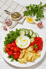 Potato Chips, leafy greens, veggies snack platter