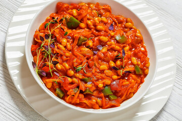 chakalaka, spicy tomato bean relish in white bowl