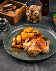 Portion of gherkin chicken with baked potatoes