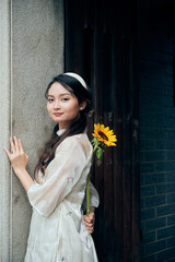 Portrait of Young Vietnamese Girl in Ao Dai visit the temple 