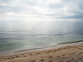 Landscape with beach, sea and cloudy dramatic sky