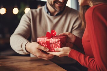 Bisexual couple exchanging Valentine day gifts heartfelt. Man and woman smile celebrating holiday providing opportunity to exchange love