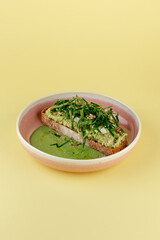 bruschetta with glucamolli and sauce on a plate