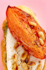 macro bruschetta on a pink background