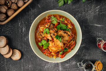 Portion of stewed chicken with vegetables