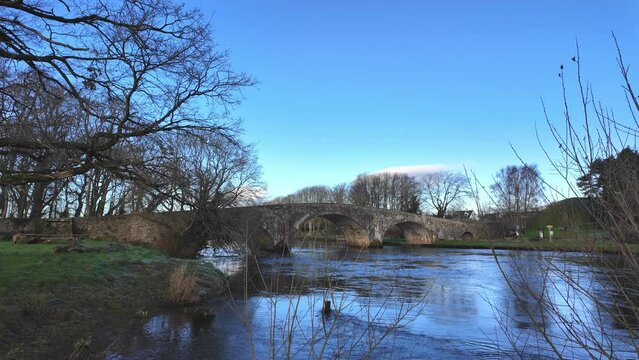 Historic old bridge on The River Suir at Kilsheelan on a cold winter day