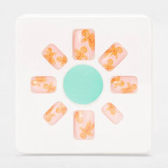 realistic set of colored false nails adhesive isolated on white background. top view. false nails acrylic nails for women. different fashion nail shapes.