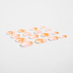 realistic set of colored false nails adhesive isolated on white background. top view. false nails acrylic nails for women. different fashion nail shapes.