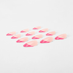 realistic set of colored false nails adhesive isolated on white background. top view. false nails...