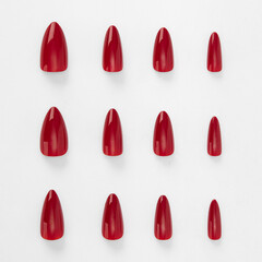 realistic set of colored false nails adhesive isolated on white background. top view. false nails...
