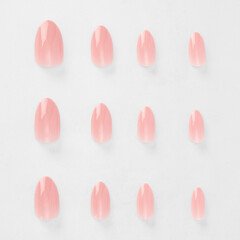 realistic set of colored false nails adhesive isolated on white background. top view. false nails...