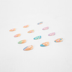 realistic set of colored false nails adhesive isolated on white background. top view. false nails acrylic nails for women. different fashion nail shapes.