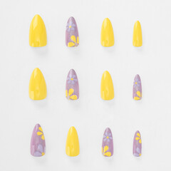 realistic set of colored false nails adhesive isolated on white background. top view. false nails acrylic nails for women. different fashion nail shapes.