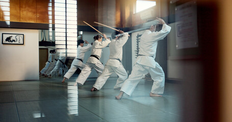 Aikido, dojo class and people training for self defense, combat and Japanese group practice sword...
