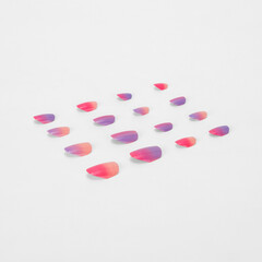 realistic set of colored false nails adhesive isolated on white background. top view. false nails...