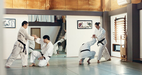 Students, karate or people learning in dojo for fitness, martial arts discipline or self defense...