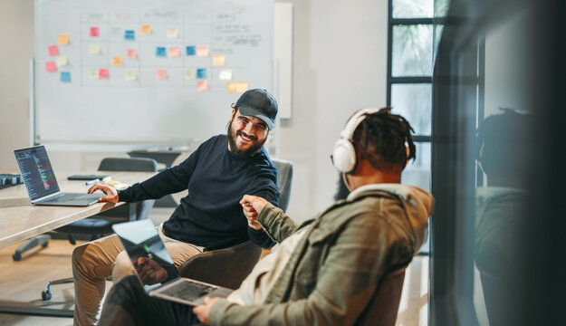 Successful collaboration: Creative business team fostering ideas in productive boardroom meeting - Powered by Adobe