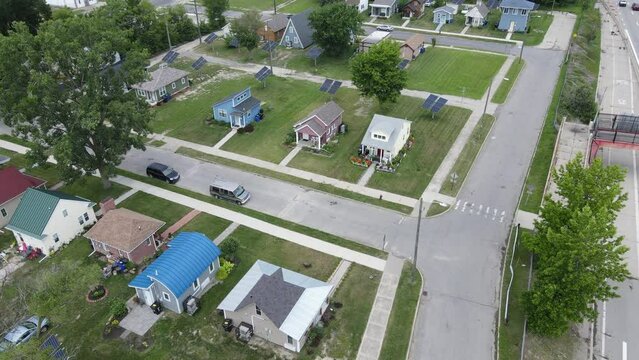 Aerial revealing drone shot of Cass community tiny homes project with Solar Panels in Detroit Michigan, USA