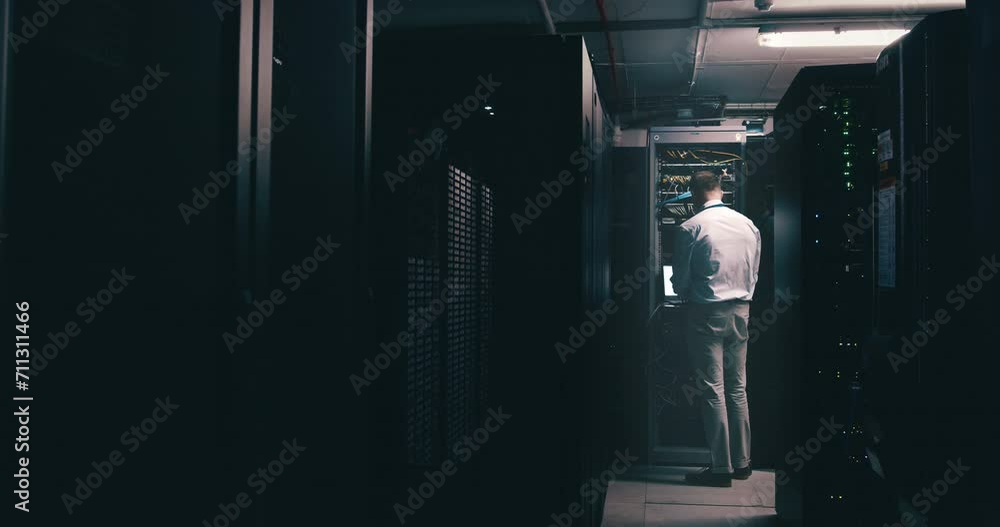 Poster Man, data center and computer for maintenance, system solution and server room coding or cyber security at night. Back of technician with laptop engineering, gdpr software and backup or cables check