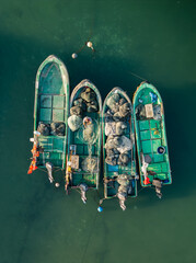 fisherman on fishing boats, top-down view