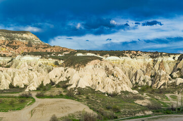 Typical Cappadocia landscape soft volcanic rock, shaped by erosion in Goreme, Turkey.