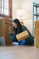 Online delivery, female small business owners are ecstatic when they see unexpected sales and...