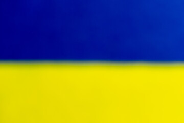 two pieces of blue and yellow fabric simulating the colors of the Ukrainian flag.