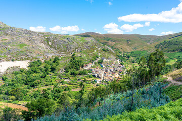 Fototapeta na wymiar general view to the uninhabited Portuguese village of Drave inserted in the valleys of Serra da Freita. Magic village