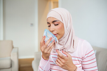 Sick Muslim woman with hijab on oxygen mask inhalation, pneumonia coronavirus pandemic. ill woman...