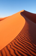 sand wave is blown from one spot in the dunes of namibia sand