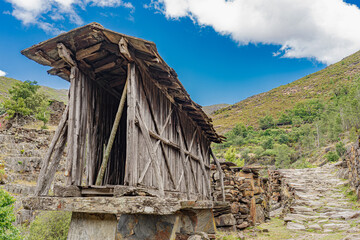 very old granary in the uninhabited village of Drave, the most isolated in Portugal. - obrazy, fototapety, plakaty