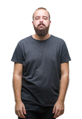Obraz premium Young caucasian hipster man over isolated background with serious expression on face. Simple and natural looking at the camera.