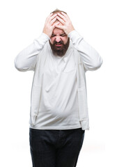 Young caucasian hipster man wearing sport clothes over isolated background suffering from headache desperate and stressed because pain and migraine. Hands on head.