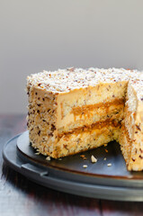 Caramel Nut Cake. Crumbled natural nuts soaked in caramel filling. Its topping on the cake is spread with caramel whipped cream  and cream cheese and roasted diced nuts.