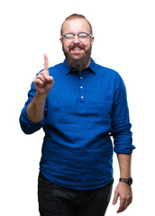 Fototapeta premium Young caucasian hipster man wearing glasses over isolated background showing and pointing up with finger number one while smiling confident and happy.