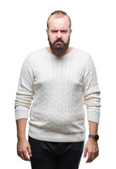 Young caucasian hipster man wearing winter sweater over isolated background skeptic and nervous, frowning upset because of problem. Negative person.