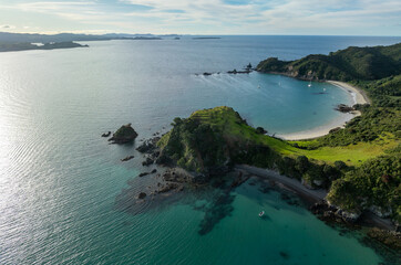 Fototapeta premium Island off the coast of Matauri Bay at sunset, Northland, New Zealand.