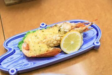 Succulent Grilled Lobster Topped with Rich Cheese Sauce